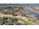Scenic aerial view of a waterfront home nestled beside a golf course with marsh views at 3232 Pignatelli Cres, Mount Pleasant, SC 29466