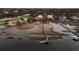 Panoramic aerial view of waterfront homes with private docks on a scenic waterway at twilight at 3232 Pignatelli Cres, Mount Pleasant, SC 29466