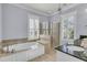 Detailed bathroom features a soaking tub, glass shower, and black countertop sink at 3232 Pignatelli Cres, Mount Pleasant, SC 29466