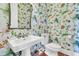 Detailed half bathroom features a pedestal sink with floral wallpaper and a framed mirror at 3232 Pignatelli Cres, Mount Pleasant, SC 29466
