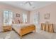 Cozy bedroom with natural wood bed, soft colors, bright windows with shutters, and neutral carpet at 3232 Pignatelli Cres, Mount Pleasant, SC 29466