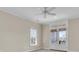 Well-lit bedroom features French doors leading to a balcony and a window with blinds at 3232 Pignatelli Cres, Mount Pleasant, SC 29466