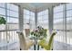 Sunlit breakfast nook featuring a glass table, seating for four, and sheer curtains at 3232 Pignatelli Cres, Mount Pleasant, SC 29466