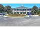 Traditional clubhouse featuring covered verandas, manicured grounds, and convenient parking at 3232 Pignatelli Cres, Mount Pleasant, SC 29466