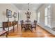 Traditional dining room with hardwood floors, wainscoting, and elegant chandelier at 3232 Pignatelli Cres, Mount Pleasant, SC 29466