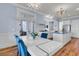 Bright dining area with modern table and chairs next to a gourmet kitchen at 3232 Pignatelli Cres, Mount Pleasant, SC 29466