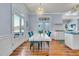 Bright dining area with modern table and chairs next to the doors leading to a balcony at 3232 Pignatelli Cres, Mount Pleasant, SC 29466