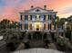 Elegant two-story home featuring symmetrical design, manicured landscaping, and inviting entryway at 3232 Pignatelli Cres, Mount Pleasant, SC 29466