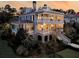 Beautiful two-story home with large porches, manicured landscaping, and a charming fence at 3232 Pignatelli Cres, Mount Pleasant, SC 29466