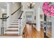 Inviting foyer features hardwood floors, staircase, and elegant decor at 3232 Pignatelli Cres, Mount Pleasant, SC 29466