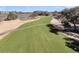 Scenic golf course view with lush green fairway and a glimpse of the clubhouse in the background at 3232 Pignatelli Cres, Mount Pleasant, SC 29466