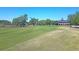 Expansive golf course view with a clubhouse in the background and trees lining the landscape at 3232 Pignatelli Cres, Mount Pleasant, SC 29466