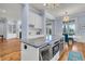 Modern kitchen with an island with marble countertop and high-end appliances at 3232 Pignatelli Cres, Mount Pleasant, SC 29466