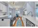Gourmet kitchen featuring white cabinets, stainless steel appliances and a long island with sink at 3232 Pignatelli Cres, Mount Pleasant, SC 29466