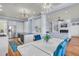Bright, open concept kitchen with an island and view to the living room and fireplace at 3232 Pignatelli Cres, Mount Pleasant, SC 29466