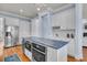 Open kitchen featuring stainless appliances, white cabinets, and blue countertops on the kitchen island at 3232 Pignatelli Cres, Mount Pleasant, SC 29466
