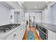 Modern kitchen with white cabinets, high-end appliances and wood floor at 3232 Pignatelli Cres, Mount Pleasant, SC 29466