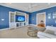 Inviting living room with built-in shelving, a TV, and a neutral-toned carpet and furnishings at 3232 Pignatelli Cres, Mount Pleasant, SC 29466
