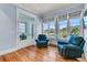 Bright living room with hardwood floors, ample windows with trim, and comfortable seating at 3232 Pignatelli Cres, Mount Pleasant, SC 29466