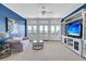 Spacious living room with a TV, built-in shelving, lots of light and french doors to the outside at 3232 Pignatelli Cres, Mount Pleasant, SC 29466