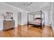 Spacious main bedroom featuring a four-poster bed and hardwood floors at 3232 Pignatelli Cres, Mount Pleasant, SC 29466