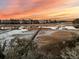 Breathtaking marsh view featuring docks and waterways under a vibrant sunset sky at 3232 Pignatelli Cres, Mount Pleasant, SC 29466