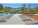Relaxing poolside scene featuring comfortable lounge chairs and a view of the water slide at 3232 Pignatelli Cres, Mount Pleasant, SC 29466