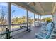 Spacious porch with nice furniture and large white pillars with views of green trees in a golf course setting at 3232 Pignatelli Cres, Mount Pleasant, SC 29466