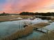 Scenic view of dock on waterway with boats under colorful sky at 3232 Pignatelli Cres, Mount Pleasant, SC 29466
