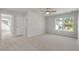 Spacious bedroom with plush carpeting, a ceiling fan, and lots of natural light from a big window at 359 Blue Oak Dr, Moncks Corner, SC 29461