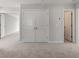 Bright bedroom with neutral carpeting and doors at 359 Blue Oak Dr, Moncks Corner, SC 29461