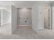 Convenient laundry room with tile floor and ample storage shelving at 359 Blue Oak Dr, Moncks Corner, SC 29461