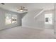 Bright living room with neutral walls, carpet, and large windows for ample natural light at 359 Blue Oak Dr, Moncks Corner, SC 29461