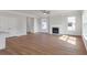 Spacious living room featuring a fireplace, wood floors, and natural light at 359 Blue Oak Dr, Moncks Corner, SC 29461