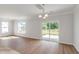 Bright living space with hardwood floors, large windows, and sliding glass doors leading to the backyard at 359 Blue Oak Dr, Moncks Corner, SC 29461