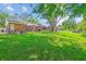 Expansive backyard with lush green grass and mature trees at 380 Furman Ln, Ladson, SC 29456