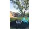 Spacious backyard with fire pit and chairs with lake access at 380 Furman Ln, Ladson, SC 29456