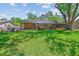 Large backyard with a brick house, patio, and shade at 380 Furman Ln, Ladson, SC 29456