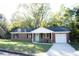 Charming one-story brick home with a well-manicured lawn and inviting curb appeal at 380 Furman Ln, Ladson, SC 29456