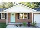 Inviting front entrance with a newly painted light blue door and fresh landscaping at 380 Furman Ln, Ladson, SC 29456