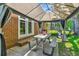 Charming gazebo next to house with dining table, seating, and views of large backyard at 380 Furman Ln, Ladson, SC 29456
