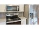 Modern kitchen with stainless steel appliances, granite countertops, and white cabinets at 380 Furman Ln, Ladson, SC 29456