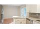 Bright kitchen featuring granite countertops, stainless steel dishwasher and access to the backyard at 380 Furman Ln, Ladson, SC 29456