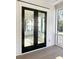 Covered balcony with black-framed glass doors and tongue-and-groove ceiling at 3845 Delinger Dr, Mount Pleasant, SC 29466
