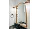Bathroom mirror and lighting fixtures above a dark granite counter add an elegant touch at 3845 Delinger Dr, Mount Pleasant, SC 29466