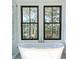 Bright bathroom features a soaking tub with windows, and a modern glass walk-in shower at 3845 Delinger Dr, Mount Pleasant, SC 29466