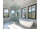 Bright bathroom features a soaking tub and modern glass walk-in shower at 3845 Delinger Dr, Mount Pleasant, SC 29466