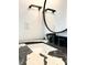 Close-up of a bathroom vanity featuring a black and white countertop, modern faucet, and round mirror at 3845 Delinger Dr, Mount Pleasant, SC 29466