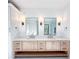 Bathroom featuring double vanity with custom mirrors and sconces at 3845 Delinger Dr, Mount Pleasant, SC 29466