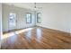 Light-filled bedroom with hardwood floors, ample windows, and a ceiling fan at 3845 Delinger Dr, Mount Pleasant, SC 29466